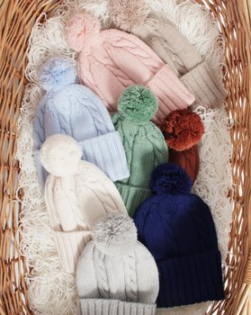 Berretto treccia pon pon in Pura Lana